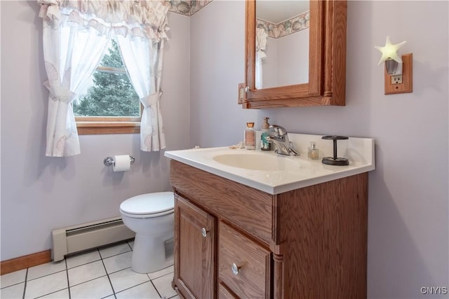 bathroom with a baseboard heating unit, toilet, tile patterned flooring, and vanity