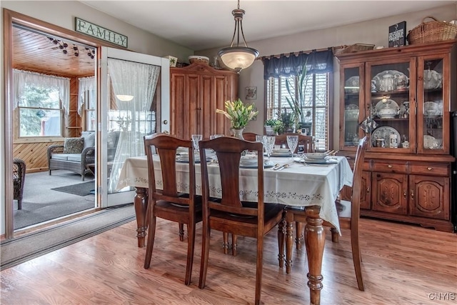 dining space featuring light wood-style floors
