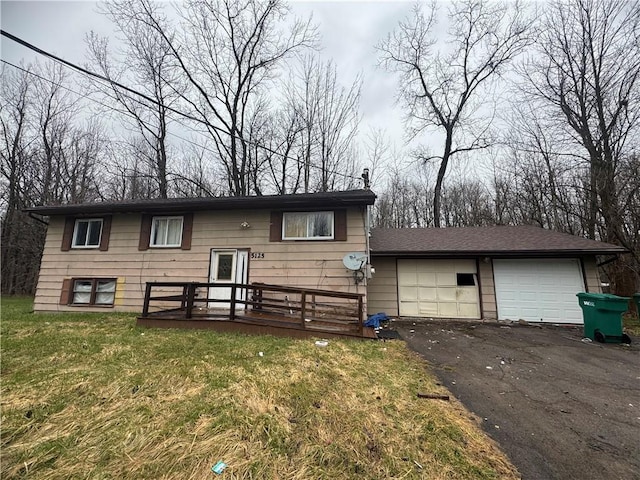 5125 Deliverance Ave, Williamson, NY 14505 - raised ranch featuring aphalt driveway, a garage, and a front lawn