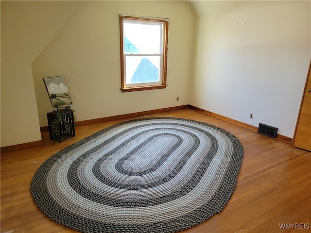 339 Lincoln Ave, Lockport-City, NY 14094 - bonus room with light wood finished floors, visible vents, baseboards, and vaulted ceiling