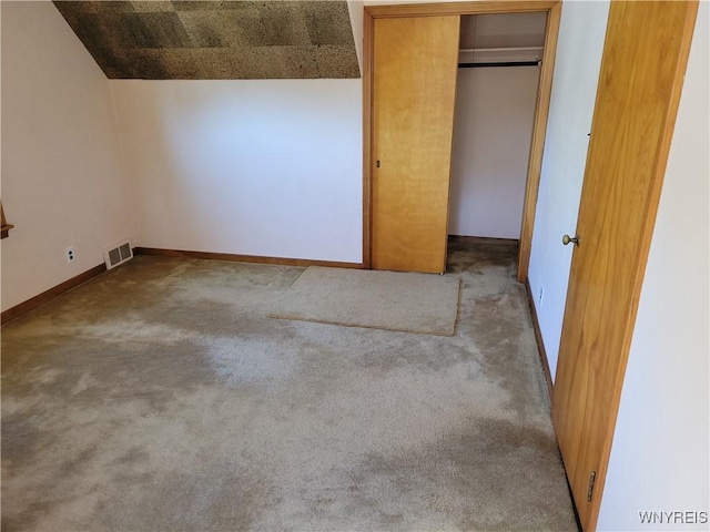 339 Lincoln Ave, Lockport-City, NY 14094 - unfurnished bedroom featuring a closet, baseboards, visible vents, and carpet floors