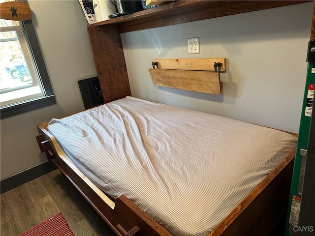 bedroom with wood finished floors