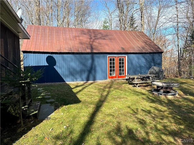 view of outdoor structure with an outdoor structure and a fire pit