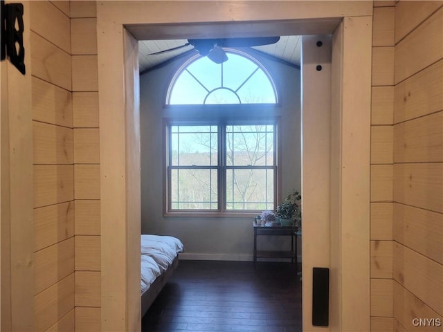 165 Howe St, Le Ray, NY 13612 - bedroom featuring multiple windows, dark wood-type flooring, lofted ceiling, and baseboards