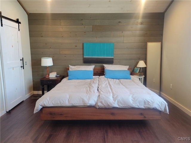 165 Howe St, Le Ray, NY 13612 - bedroom featuring wood finished floors, baseboards, a barn door, and wood walls