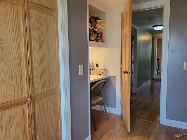 165 Howe St, Le Ray, NY 13612 - corridor featuring wood finished floors, an office area, and baseboards