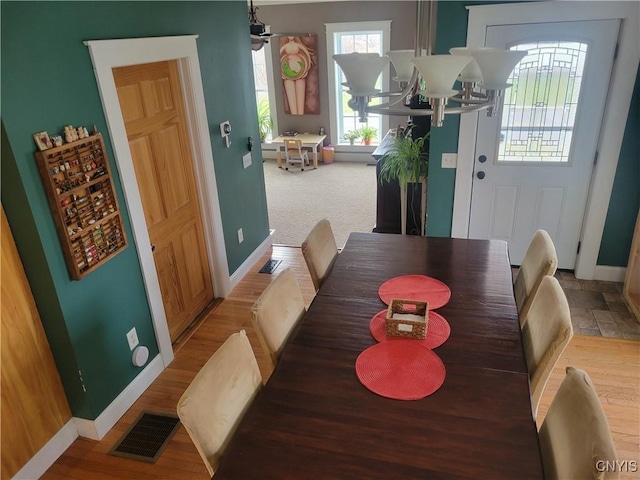 165 Howe St, Le Ray, NY 13612 - dining room featuring baseboards and a chandelier