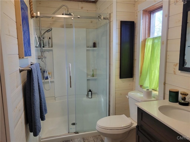 165 Howe St, Le Ray, NY 13612 - full bathroom with toilet, a shower stall, vanity, and wood walls