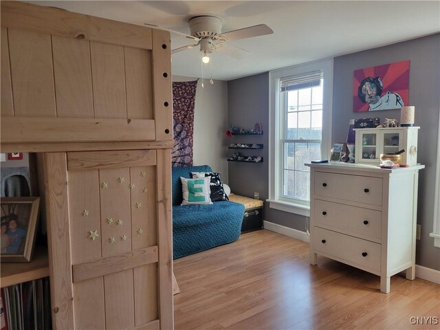 165 Howe St, Le Ray, NY 13612 - bedroom with light wood-type flooring, baseboards, and a ceiling fan