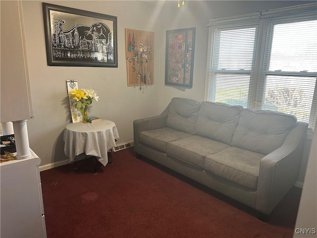 918 Midland Ave, Syracuse, NY 13205 - living area with visible vents, baseboards, and dark colored carpet
