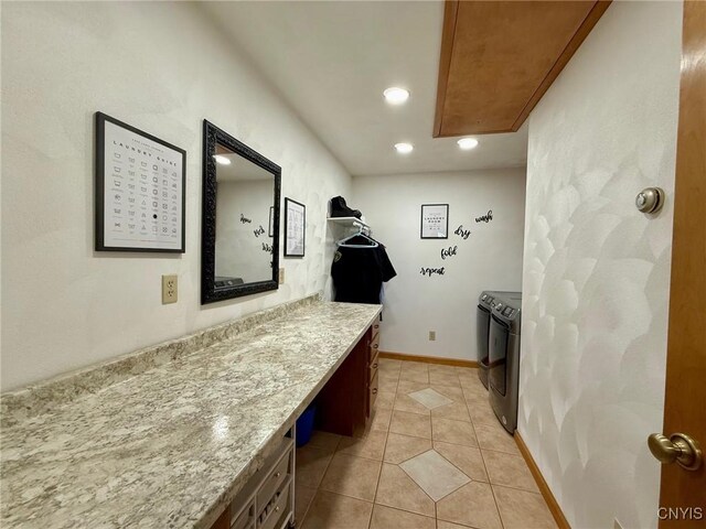 interior space with recessed lighting, washing machine and dryer, baseboards, and light tile patterned flooring