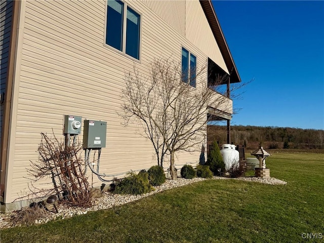 view of side of home featuring a yard