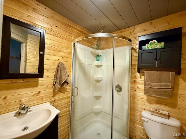 full bathroom featuring wooden ceiling, a sink, toilet, a shower stall, and wood walls