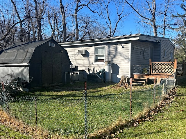 view of shed featuring fence