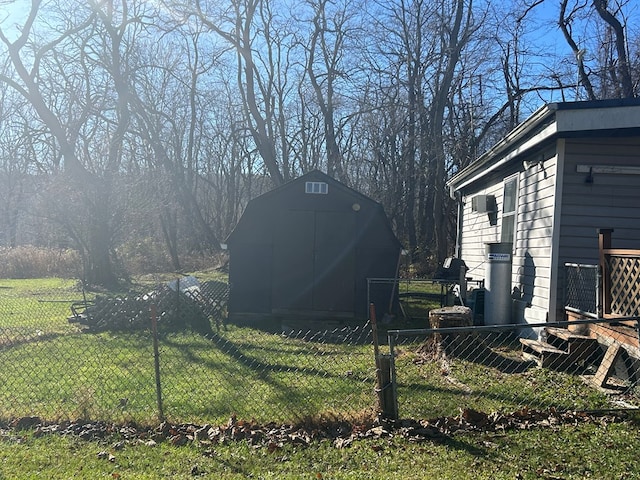 view of yard with a storage shed, fence, and an outdoor structure