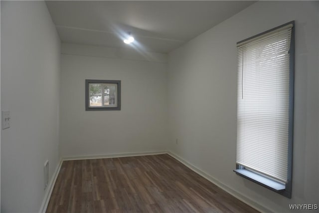 705 Irving St, Olean-City, NY 14760 - unfurnished room featuring baseboards and dark wood-style flooring