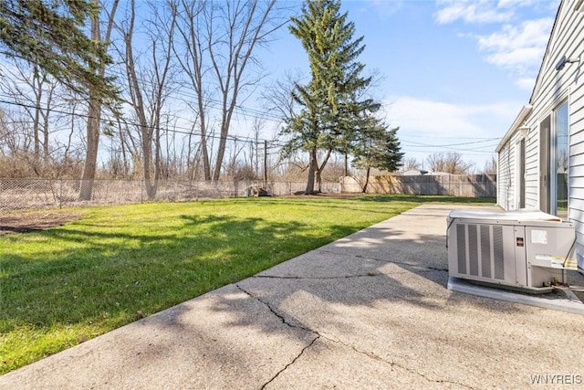 view of yard with a patio, central air condition unit, and a fenced backyard