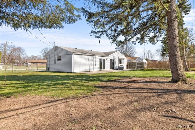 back of house with a patio, central AC unit, fence, and a lawn