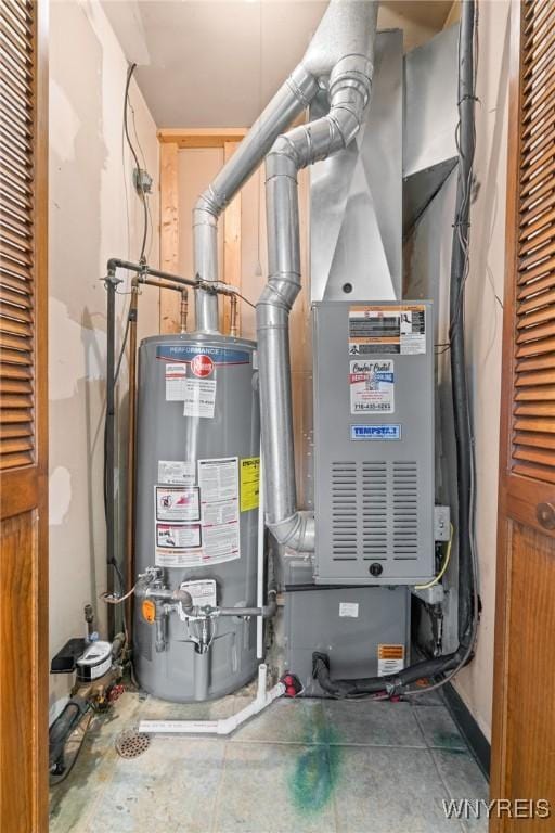 utility room featuring gas water heater