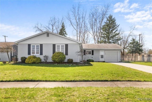 single story home with driveway, fence, a garage, and a front lawn