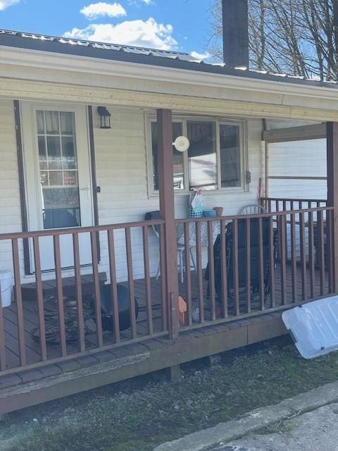 view of exterior entry featuring a porch