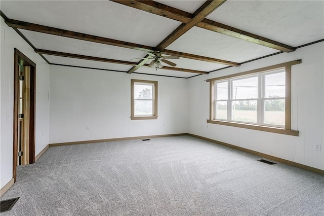 empty room with visible vents, ceiling fan, and carpet floors