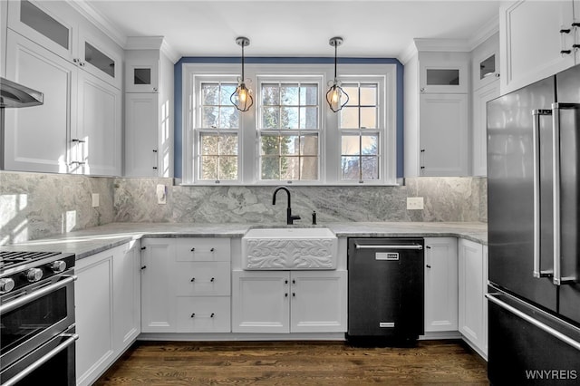 kitchen featuring crown molding, appliances with stainless steel finishes, a sink, and white cabinetry