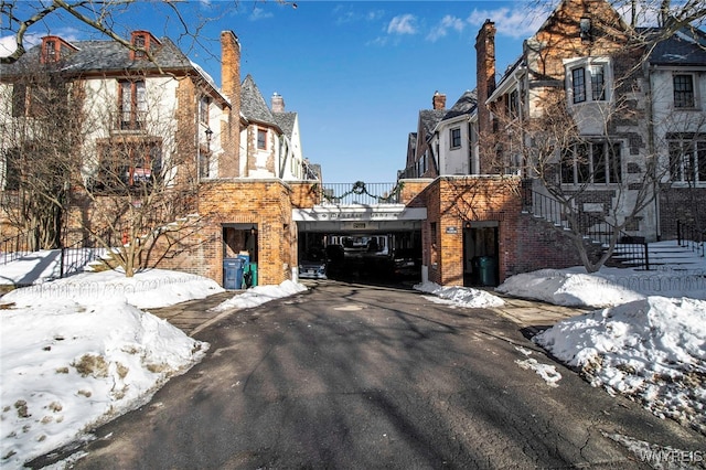 view of street featuring aphalt driveway