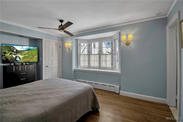 bedroom featuring baseboards, ornamental molding, ceiling fan, a baseboard radiator, and wood finished floors
