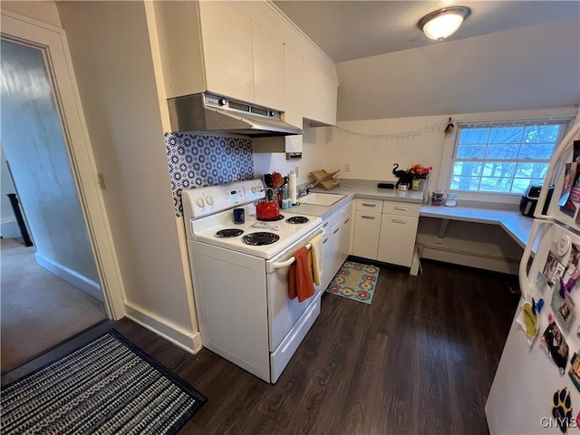 kitchen featuring white appliances, white cabinetry, under cabinet range hood, dark wood-style flooring, and light countertops