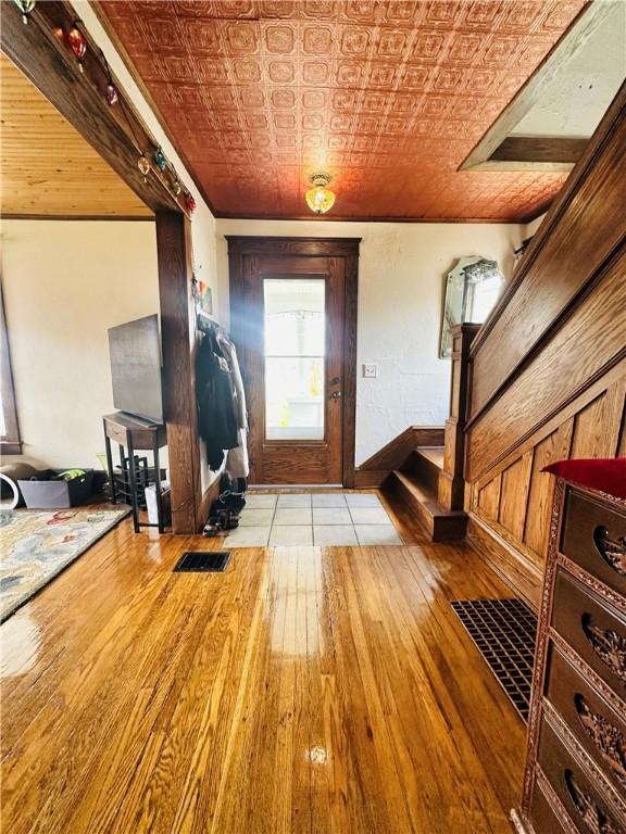 930 W 1st St, Elmira, NY 14905 - foyer entrance with an ornate ceiling, wood finished floors, and baseboards