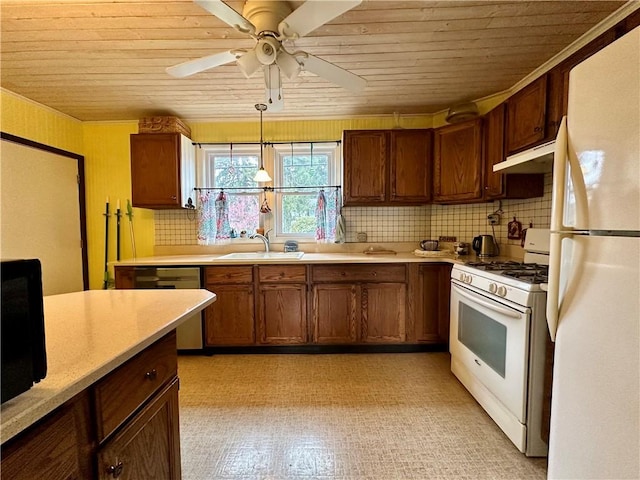 930 W 1st St, Elmira, NY 14905 - kitchen with white appliances, wooden ceiling, a sink, light countertops, and under cabinet range hood