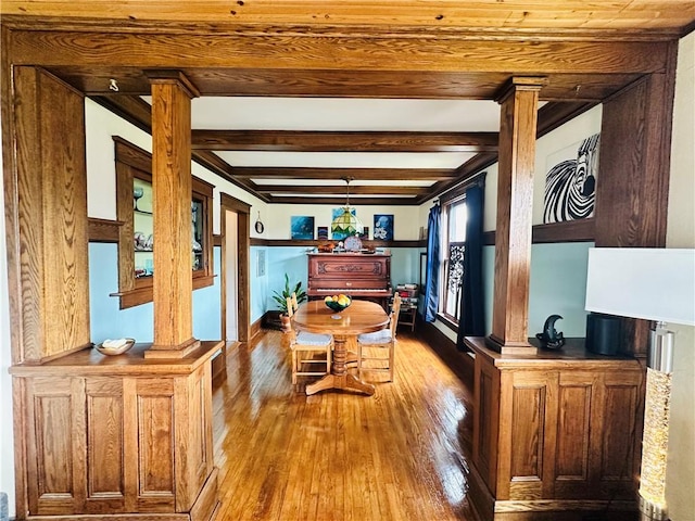 930 W 1st St, Elmira, NY 14905 - dining space with hardwood / wood-style flooring, ornate columns, and beamed ceiling