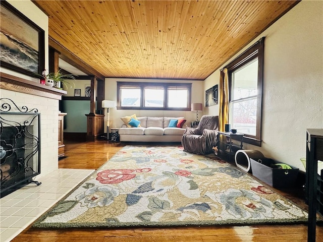 930 W 1st St, Elmira, NY 14905 - living area with wood ceiling, wood finished floors, and a brick fireplace