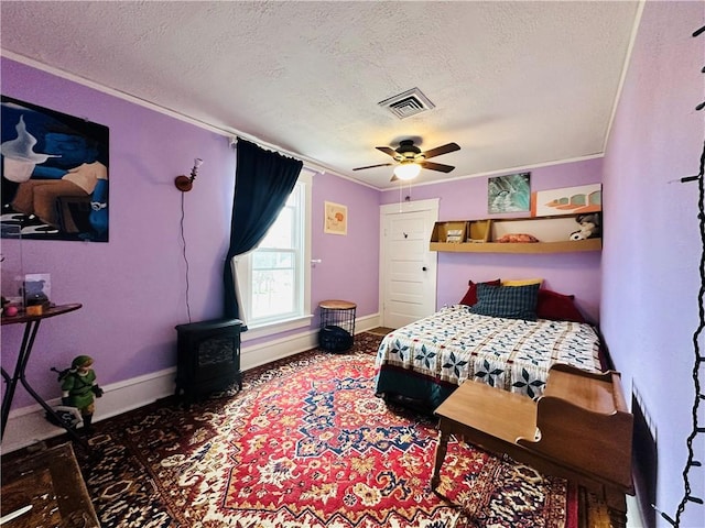 930 W 1st St, Elmira, NY 14905 - bedroom with a textured ceiling, baseboards, crown molding, carpet, and ceiling fan