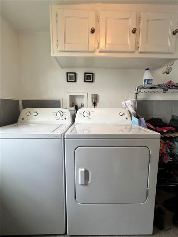 930 W 1st St, Elmira, NY 14905 - clothes washing area featuring washing machine and clothes dryer and cabinet space