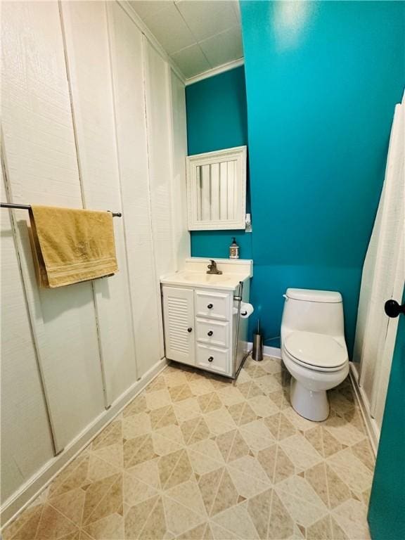 930 W 1st St, Elmira, NY 14905 - bathroom with toilet, vanity, and baseboards