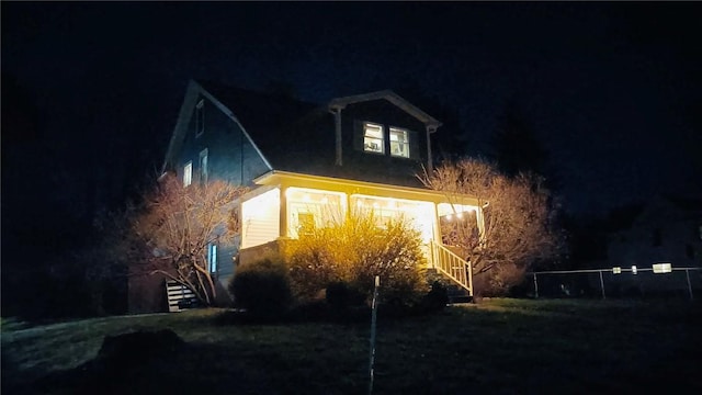 930 W 1st St, Elmira, NY 14905 - property exterior at night featuring stairs