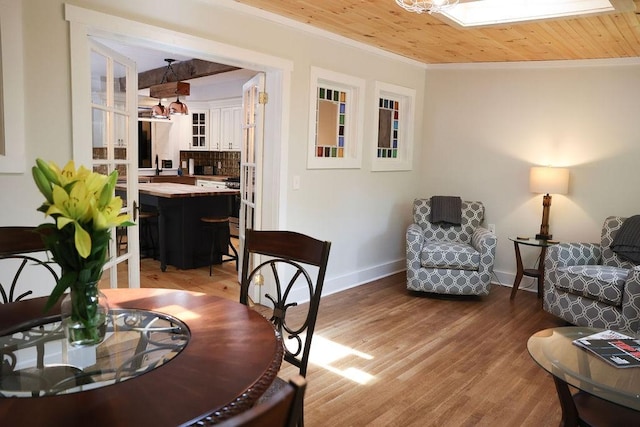 16441 W Lake Rd, Pulteney, NY 14418 - living room featuring crown molding, baseboards, light wood-style floors, and wood ceiling