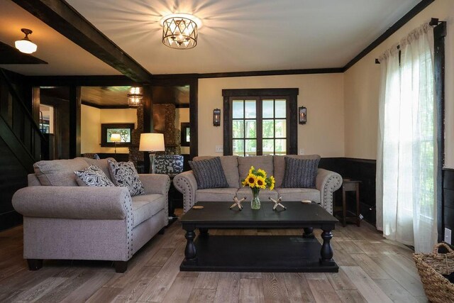 16441 W Lake Rd, Pulteney, NY 14418 - living area featuring ornamental molding, beam ceiling, stairway, and wood finished floors