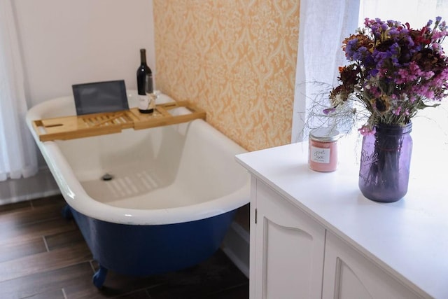 16441 W Lake Rd, Pulteney, NY 14418 - full bathroom with a freestanding tub, wood finished floors, and wallpapered walls