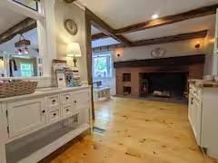 16441 W Lake Rd, Pulteney, NY 14418 - interior space with beam ceiling and light wood-style flooring