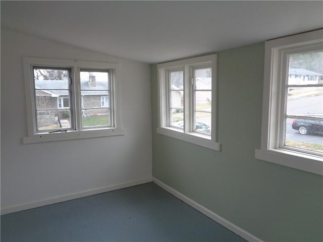 252 W 2nd St, Corning-City, NY 14830 - empty room featuring baseboards, lofted ceiling, and a wealth of natural light