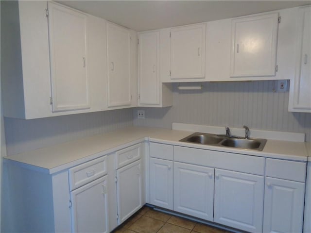 252 W 2nd St, Corning-City, NY 14830 - kitchen with a sink, light countertops, and white cabinetry
