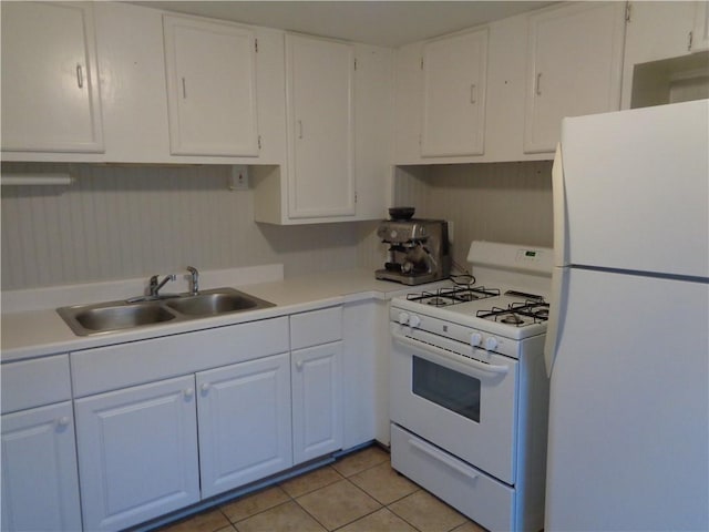 252 W 2nd St, Corning-City, NY 14830 - kitchen featuring light tile patterned floors, a sink, light countertops, white appliances, and white cabinetry