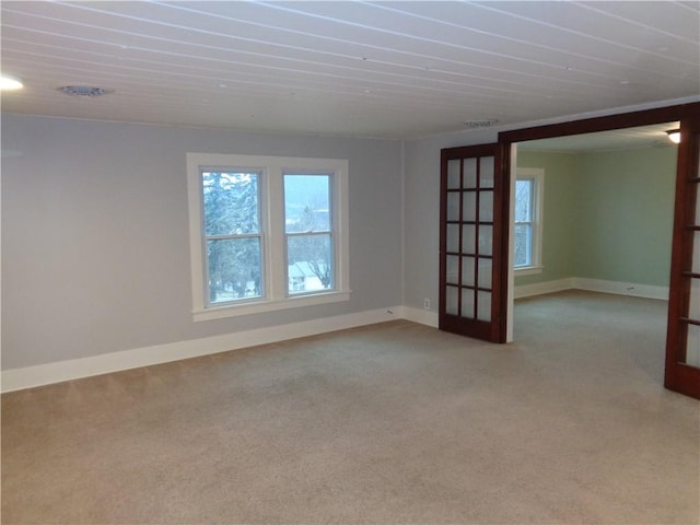 252 W 2nd St, Corning-City, NY 14830 - carpeted empty room featuring french doors and baseboards