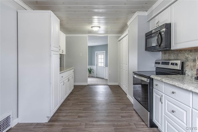 kitchen with white cabinets, black microwave, visible vents, and stainless steel electric range oven
