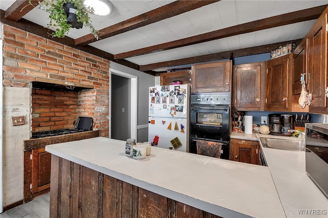 192 Pine St, Lockport City, NY 14094 - kitchen with a sink, light countertops, light wood-style floors, beamed ceiling, and black appliances