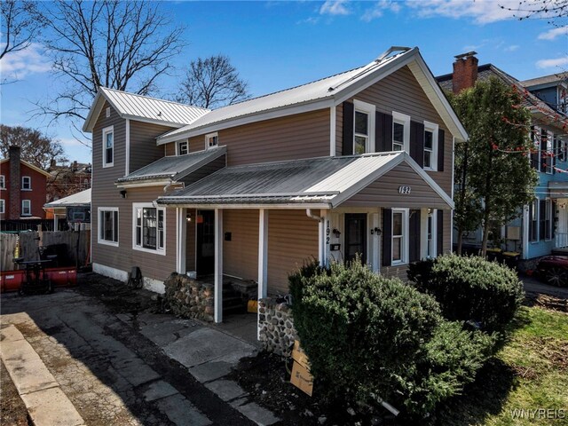 192 Pine St, Lockport City, NY 14094 - view of front of house with metal roof, fence, and covered porch