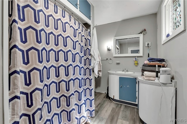 192 Pine St, Lockport City, NY 14094 - bathroom featuring baseboards, a shower with shower curtain, vanity, and wood finished floors